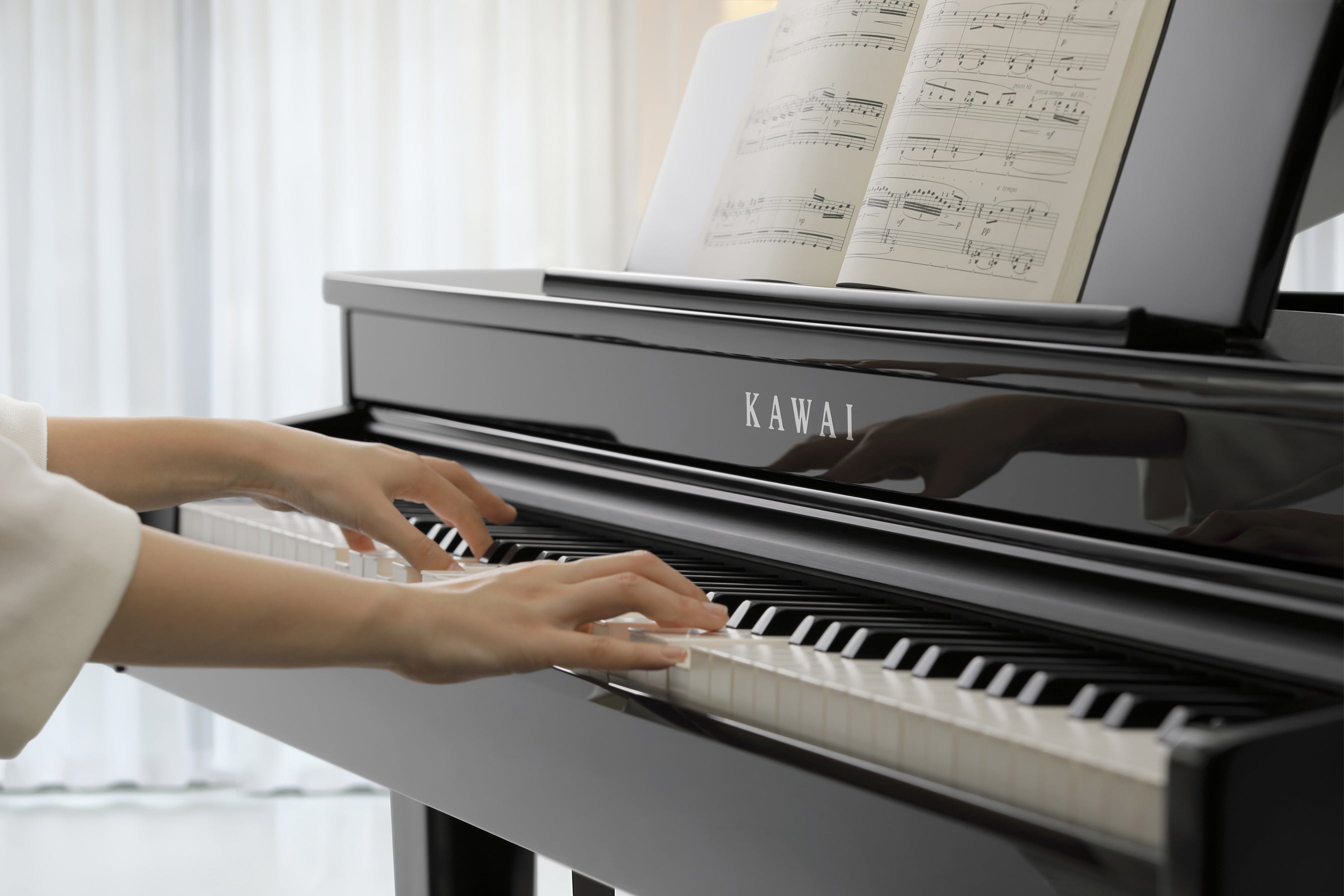 Hands playing the Kawai DG30 digital grand piano