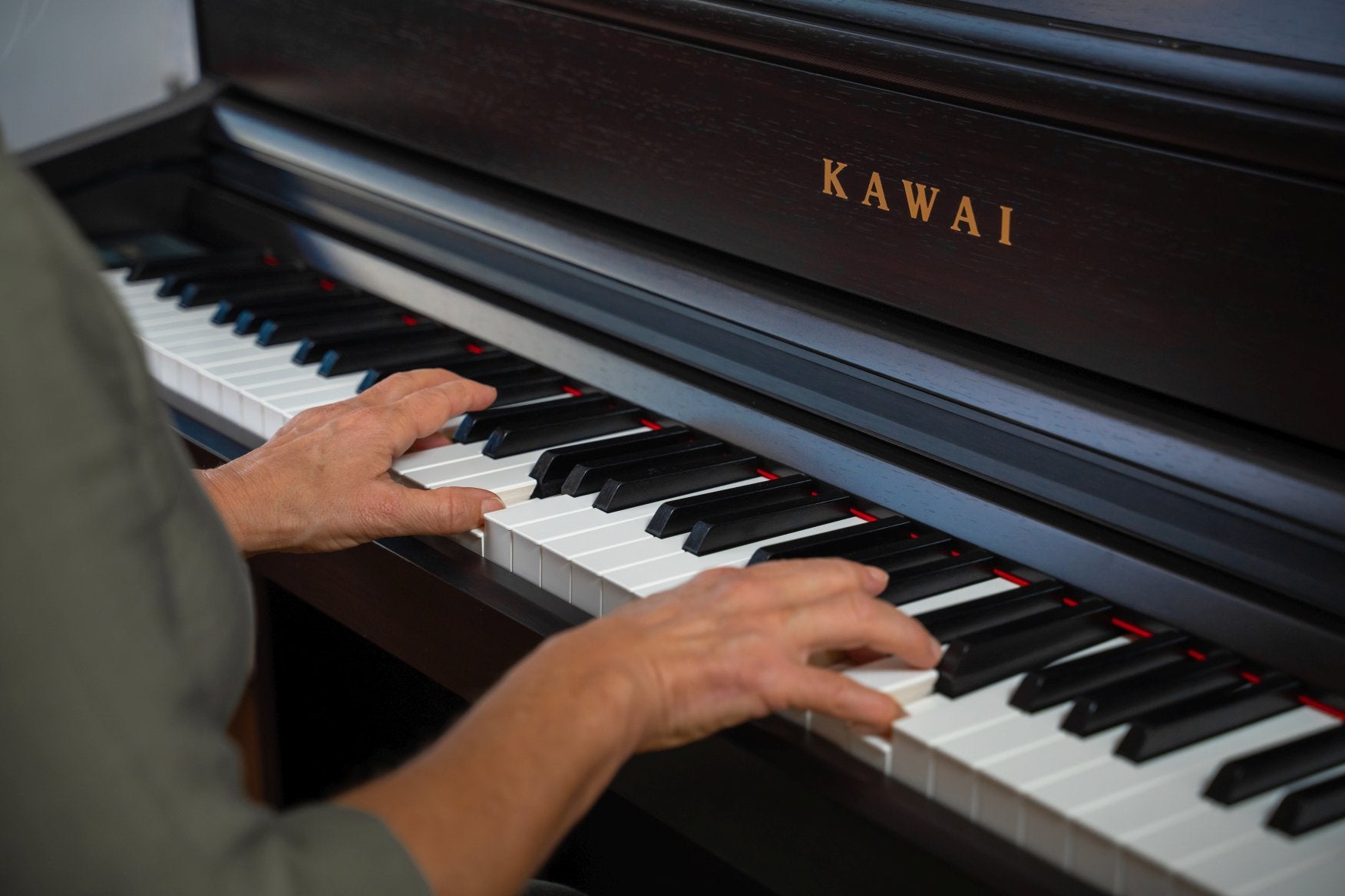 Hands playing a Kawai CA701