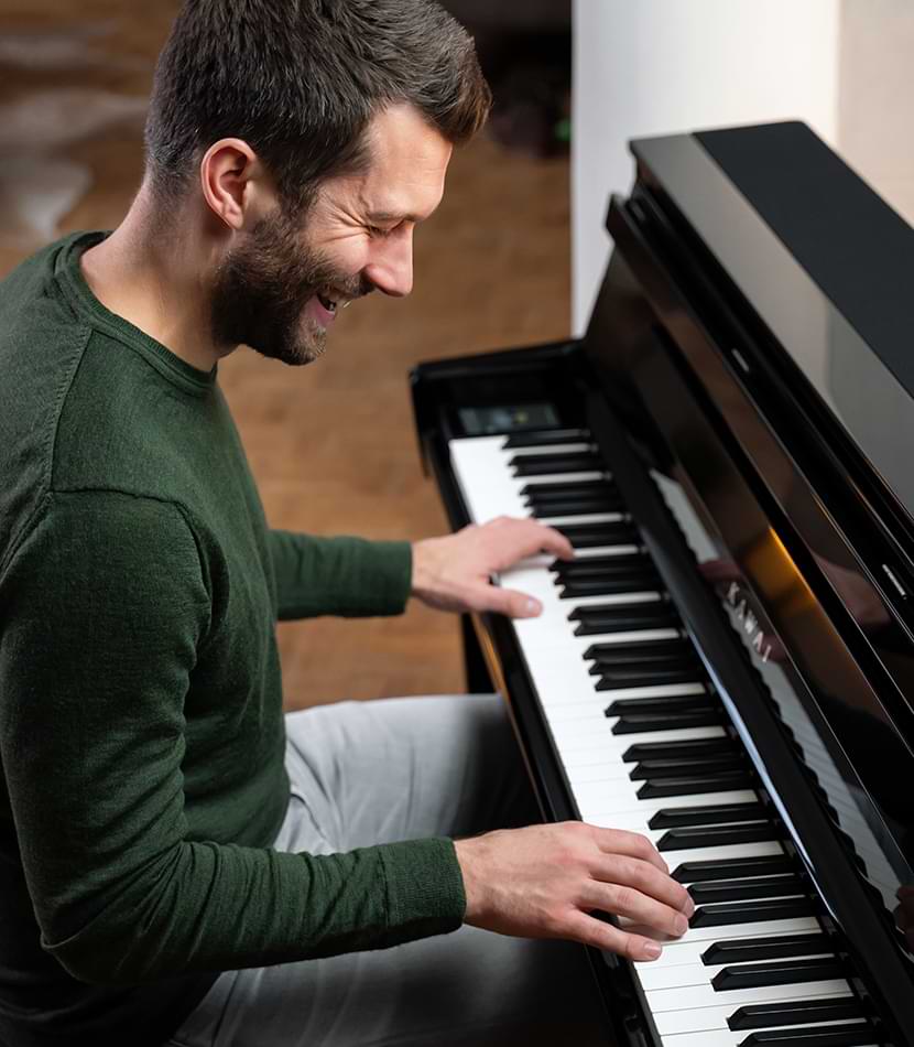 Man playing Kawai CA901 digital piano