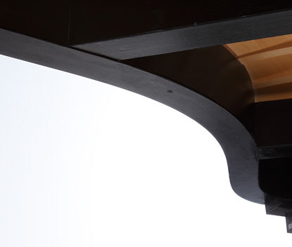 Underside inner rim of a Kawai grand piano